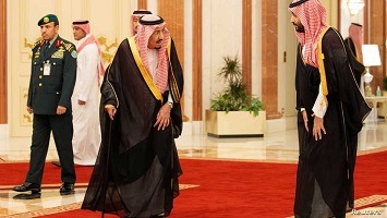 Saudi Arabia’s King Salman bin Abdulaziz walks with Crown Prince of Saudi Arabia Mohammad bin Salman during the Gulf Cooperation Council (GCC) summit in Mecca